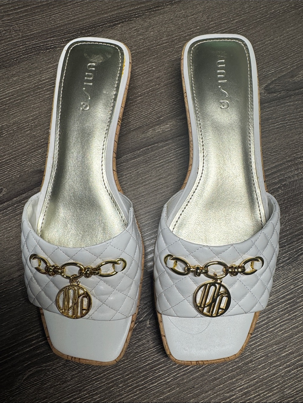 Unisa White Quilted Slide Mules with Gold Chain Medallion